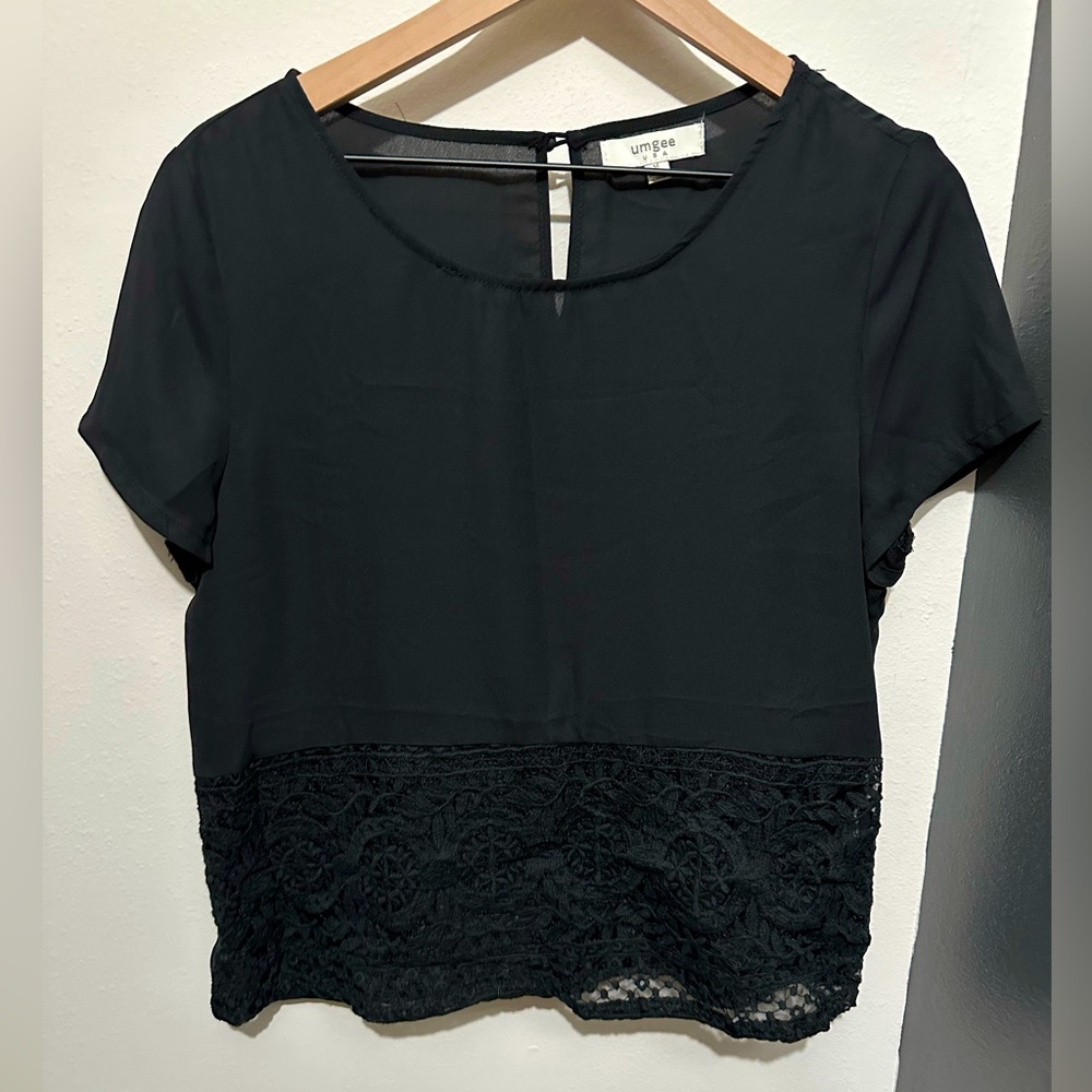 Umgee black blouse with lace accent on bottom.